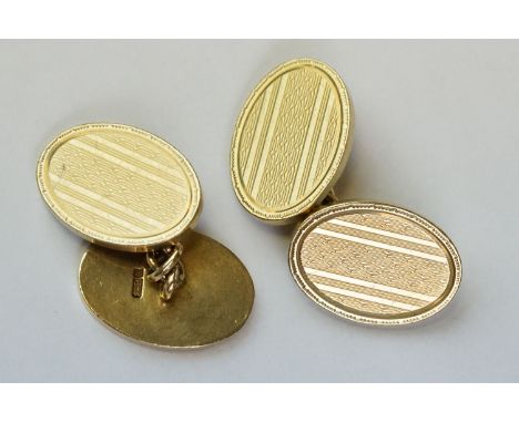 Pair of 9ct yellow gold chain link cufflinks, engine turned decoration to each oval panel, length of each panel approx 18.5mm