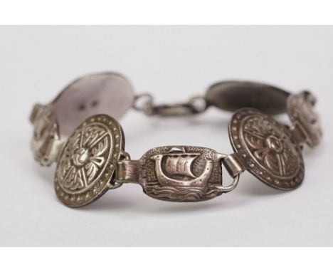 Scottish silver panel bracelet, comprising four target-style panels and three oval panels with ships in relief, makers Robert