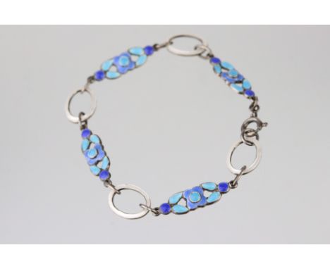 Bernard Instone enamelled panel bracelet, four enamelled blue floral panels and four white enamel oval hoops, bolt ring clasp