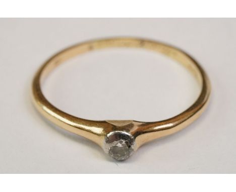 Diamond solitaire 14ct yellow gold ring, the round brilliant cut diamond weighing approx 0.10 carat, rub over set, ring size 