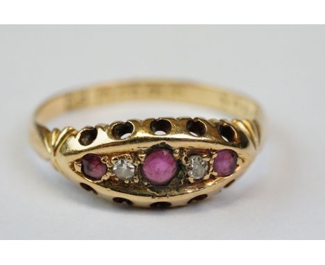 Edwardian ruby and diamond 18ct yellow gold boat head ring, three small graduated mixed cut rubies and two small eight cut di