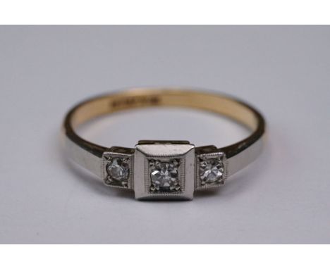 Circa 1920s diamond three stone 18ct yellow gold and platinum set ring, three small round eight cut diamonds, illusion set, m