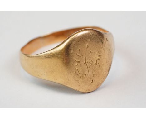 Unmarked yellow gold signet ring, rubbed initials to oval panel, tapered shoulders, hallmarks rubbed/ evidence of band resizi
