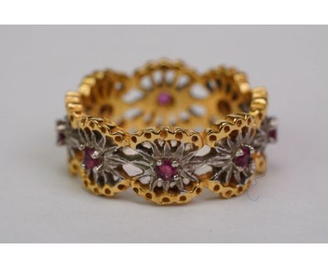 Ruby 14ct yellow and white gold flower head eternity ring, eight small round mixed cut rubies, four claw set, pierced design,