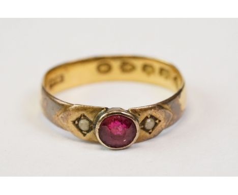 Victorian ruby and seed pearl 22ct yellow gold ring, the circular mixed cut ruby diameter approx 4mm, rub-over setting, hallm