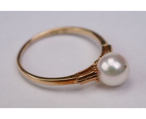 Mikimoto single pearl 14ct yellow gold dress ring, the white lustre spherical pearl with pink and green overtones, diameter a