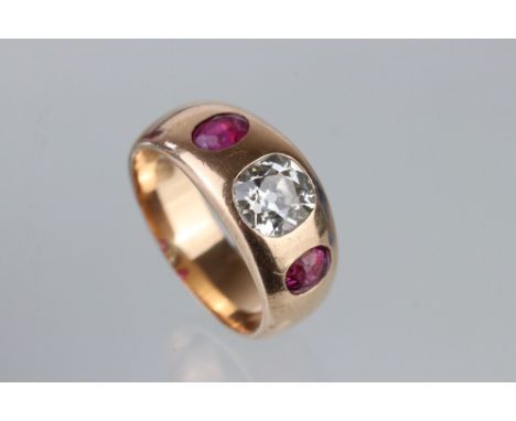 Diamond and ruby unmarked rose gold ring, the central cushion cut diamond weighing approx 1.0 carat, assessed clarity VS, ass