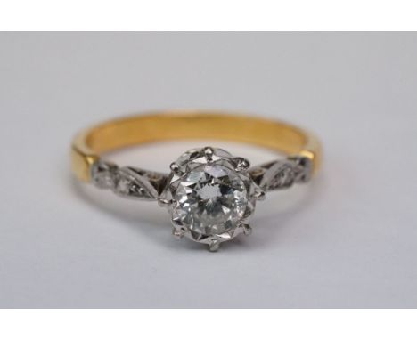 Diamond solitaire unmarked yellow gold and platinum set ring, the round brilliant cut diamond weighing approx 0.75 carat, ass