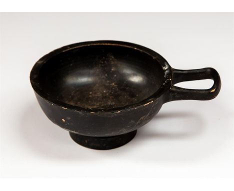 Greek Magna Gracian black glazed pottery cup with single handle. C. 4th Century BC.&nbsp; &nbsp;A black-glazed ceramic cup wi