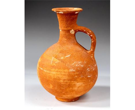 Cypriot Shipwrecked Ceramic Jug, Iron Age, C. 8th - 6th Century BC.    A red burnished jug with flared mouth and globular bod
