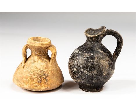 A pair of Roman juglets, C. 2nd - 4th Century AD.&nbsp; &nbsp;A group of ceramic juglets. Black glazed version with a cylindr