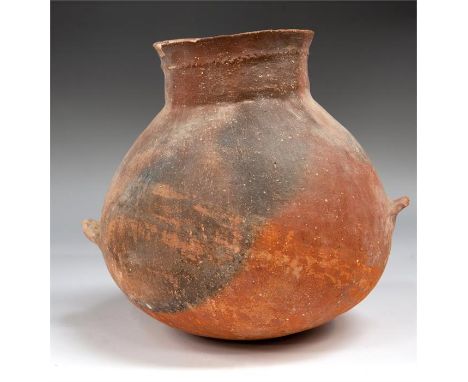 Early Bronze Age Holy Land Jar with lovely red burnish still remaining.Two ledge handles on each side and tall neck and dimpl