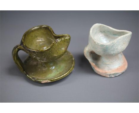 Islamic Oil Lamp Pair, 12th century AD A pair of ceramic oil lamps, both with oval bodies, one end pinched to form a nozzle; 