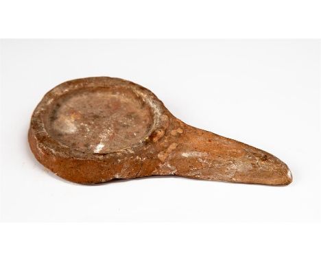 Roman oil lamp holder, C. 1st - 3rd Century AD.&nbsp; &nbsp;A long handled ceramic oil lamp holder. 13.2cm.