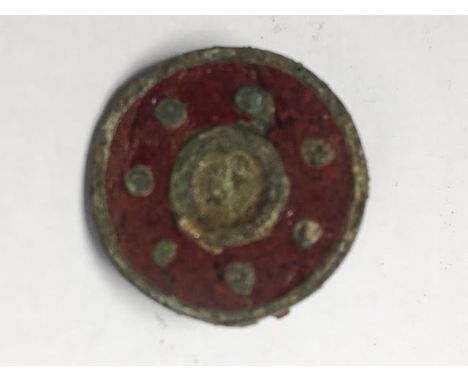 Roman Shield Brooch with pin intact, C. 2nd - 4th Century AD. A shield brooch with red enamel with dotted detail.Provenance: 