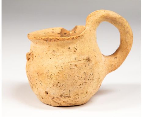 Western Asiatic Early Chalcolithic Cup. C.3000 BC.&nbsp; &nbsp;A ceramic single handled cup with double nipple design. 6.5cm.