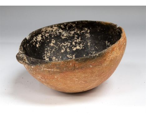 A Early Bronze Age red burnished bowl with lip, C. 2900 BC.A small Early Bronze Age red burnished bowl with lip. 10cm Dia.