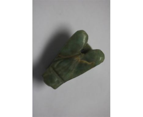 Egyptian Fly Amulet, Late Period, 664-332 BC.&nbsp; A green stone amulet of a fly with engraved details to the wings and eye.
