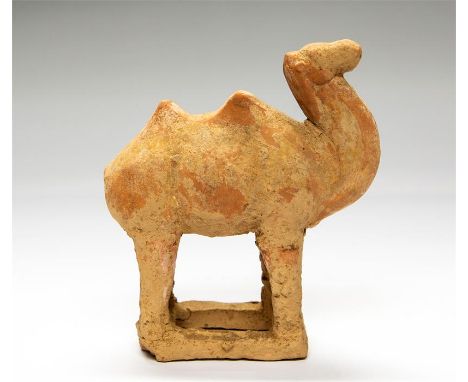 Chinese Tang Dynasty Camel, 618-907 AD  A ceramic figure of a camel with two humps to the back, neck arched. Slender legs sta