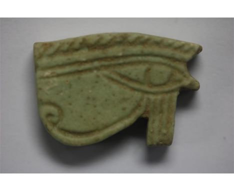 Egyptian Wadjet Eye of Horus Amulet, Ptolemaic Period, 332-30 BC.&nbsp; A faience amulet of the Eye of Horus with engraved de
