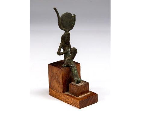 Egyptian Isis Nursing Horus Statuette, Late Period, 664-332 BC.&nbsp; &nbsp; A bronze statuette of the goddess Isis, seated, 