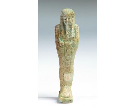 Translated Egyptian faience shabti, inscribed to Nes-Khonsu, C. 664 - 525 BC.  A light glazed Egyptian shabti inscribed for t