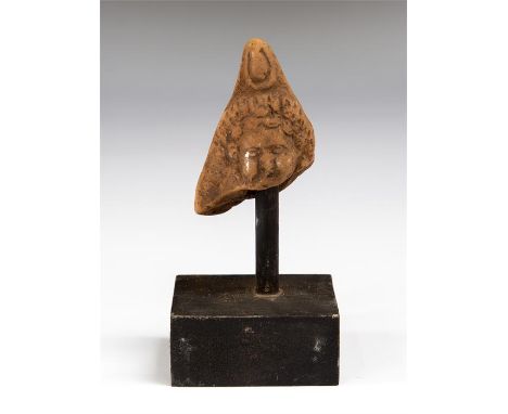 Egyptian Harpocrates Statuette Head, Roman Period, 1st century BC - 2nd century AD.&nbsp; &nbsp; A ceramic head of the god Ha