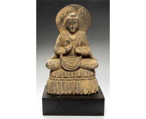 Gandhara Buddha in Discussion Statue, 2nd-3rd century AD  A schist statue of Buddha, hair pulled up into a ushnisha top-knot,