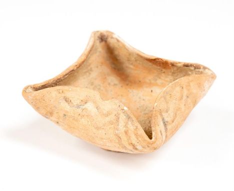 Indus Valley Oil Lamp, 2nd millennium BC  A ceramic lamp formed as a bowl with four nozzles pinched to the rim. Bands of wavy