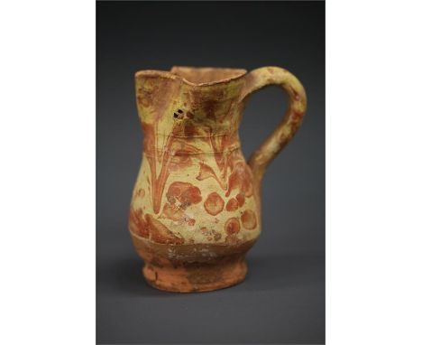Medieval Marble Glazed Jug, 13th-15th century AD A ceramic jug with pinched end to form a spout, loop handle to the back. The