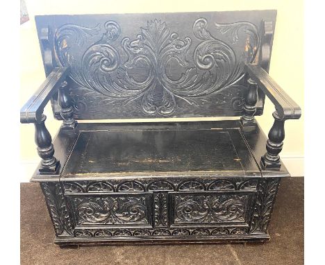 Oak heavily carved monks bench measures approx height 31" width 43" dept 20" 