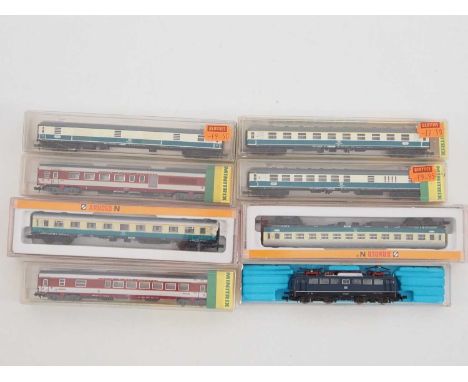 A group of MINITRIX, ARNOLD and FLEISCHMANN European outline N gauge rolling stock comprising a BR110 class electric locomoti