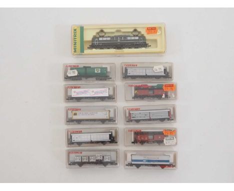 A group of MINITRIX and FLEISCHMANN German outline N gauge rolling stock comprising a BR151 class electric locomotive and a g