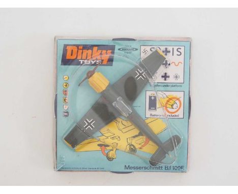 A Dinky Toys No 726 Messerschmitt BF109E - finished in drab greenish-grey with yellow flashes and blue undercarriage, brown p