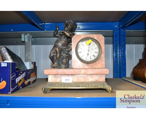 An Art Deco style mantel clock with cherub decoration AF