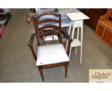 A ladder back elbow chair and a painted plant stand