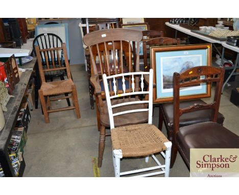 An elm seated stick back elbow chair and a rush seated white painted chair