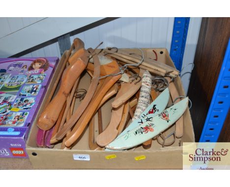 A box of various vintage and other coat hangers