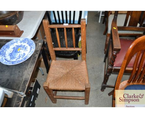 A rush seated stick back chair