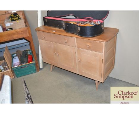 An Ercol sideboard fitted two drawers, raised on cupboard base 