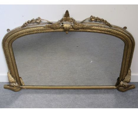 A 19th Century gilt and gesso overmantel mirror with beaded surround and leaf crest. 78cm x 114cm
