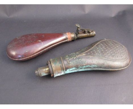 A 19th Century brass powder flask, leather shot flask and silverplate cup with lead shot contents a/f