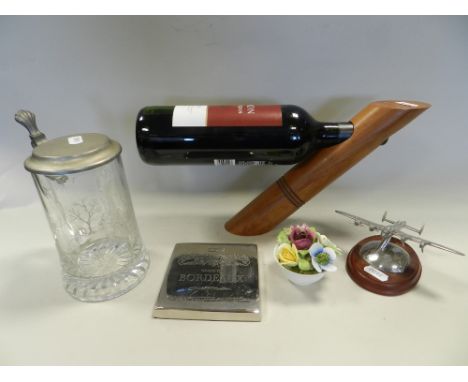 Works of Art to include: a metal table top wine rack, an Australian carved wood wine bottle holder, a stainless steel ice buc