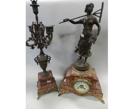 A French pink marble spelter and gilt metal clock garniture, the clock case surmounted with a figure titled 'Retour des Foins