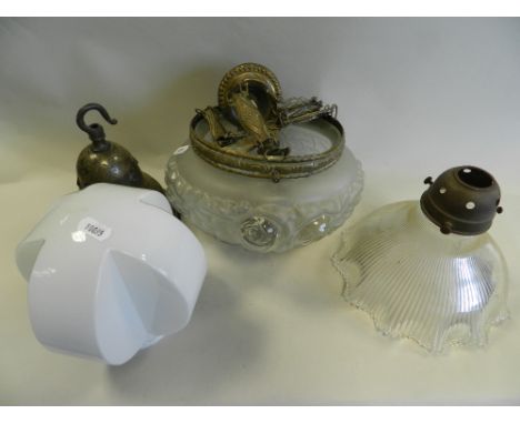 A quantity of early 20th century and later glass lighting shades, in various forms including an opalescent Art Deco style glo