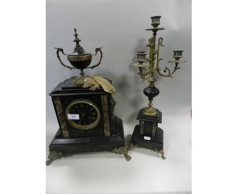 A late 19th century French black and veined marble clock garniture, the clock with vase finial flanked by three branch candel