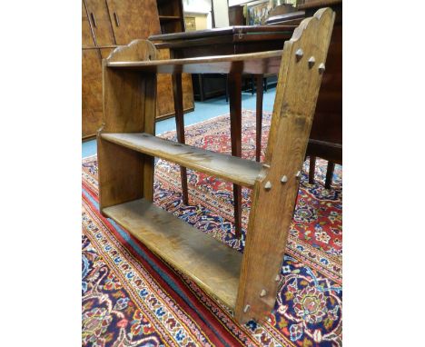 A Victorian oak Gothic revival three tier open wall hanging shelf 