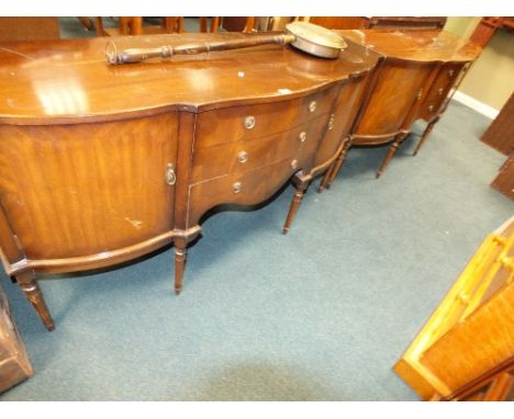 Two 20th century reproduction mahogany finished sideboards along with a brass warming pan and a stained wooden fire surround 