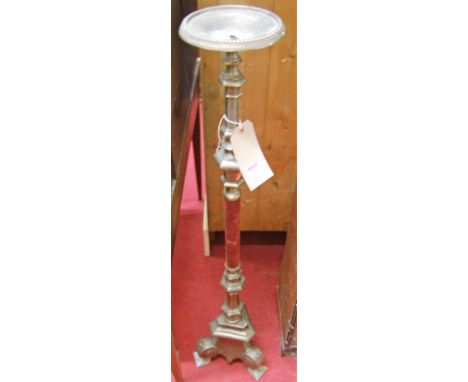 A Continental cast metal and velvet clad freestanding pricket stick