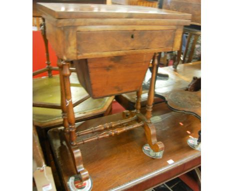 A mid-Victorian figured walnut games table, having rotating fold-over top inlaid with chessboard and backgammon, over single 